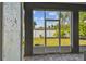 Screened patio offering views of a well-maintained backyard and blue skies at 4007 W Gray St, Tampa, FL 33609