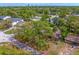 An aerial view of the property showcasing its prime location near downtown and mature trees at 4302 W Woodmere Rd, Tampa, FL 33609