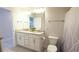 Well-lit bathroom with dual sinks, granite countertops, and modern fixtures at 4444 Boyer Ter, North Port, FL 34288