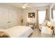 This bedroom is bright and features a ceiling fan, closet with doors, desk, and chair at 4444 Boyer Ter, North Port, FL 34288