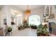 Bright foyer with tile floors, arched doorways, lots of plants, and natural light at 4444 Boyer Ter, North Port, FL 34288