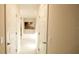Hallway leads to a bathroom with tub and separate shower at 4444 Boyer Ter, North Port, FL 34288