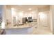 Well-lit kitchen featuring granite countertops, white cabinets, and stainless-steel appliances at 4444 Boyer Ter, North Port, FL 34288