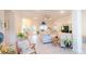 Spacious open-concept living room with neutral tones, light wood flooring, and modern furnishings at 4444 Boyer Ter, North Port, FL 34288