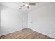 Bedroom features ceiling fan, hardwood style floors, neutral paint, closet for storage, and window for natural light at 4701 14Th S Ave, St Petersburg, FL 33711