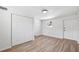 Bright bedroom features hardwood style floors, neutral paint, window for natural light, and closet for storage at 4701 14Th S Ave, St Petersburg, FL 33711