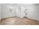 Spacious bedroom showcases hardwood style floors, neutral paint, window for natural light, and closet for storage at 4701 14Th S Ave, St Petersburg, FL 33711