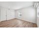 Bright bedroom features hardwood style floors, neutral paint, window for natural light, and closet for storage at 4701 14Th S Ave, St Petersburg, FL 33711