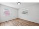 Bright bedroom features hardwood style floors and natural light from two windows at 4701 14Th S Ave, St Petersburg, FL 33711