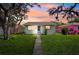 Charming home with a well-manicured lawn and a neatly paved walkway leading to the inviting blue front door at 4701 14Th S Ave, St Petersburg, FL 33711