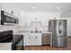 Modern kitchen featuring stainless steel appliances, sleek countertops, and ample cabinet space at 4701 14Th S Ave, St Petersburg, FL 33711