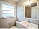 Clean bathroom featuring a white vanity, and a window for natural light at 503 W Lee St, Plant City, FL 33563