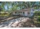 Charming single-story home featuring light grey siding and a well-maintained front yard at 503 W Lee St, Plant City, FL 33563