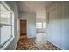 Cozy living room featuring unique tiled floors, wood walls, and bright, natural light at 503 W Lee St, Plant City, FL 33563