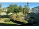 Serene landscaping with lush greenery and well-maintained shrubs surrounding the condo building creates an inviting outdoor space at 5750 80Th N St # B203, St Petersburg, FL 33709