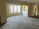 Living room featuring slider to the balcony and showing deferred maintenance at 5750 80Th N St # B203, St Petersburg, FL 33709