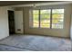 Living room featuring a slider door, a ceiling fan, and views of the yard at 5750 80Th N St # B203, St Petersburg, FL 33709