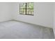 Bedroom with carpet, window, and bright natural light at 7227 Otter Creek Dr, New Port Richey, FL 34655