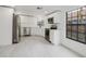 Modern kitchen with white cabinets, quartz countertops, and stainless steel appliances at 7227 Otter Creek Dr, New Port Richey, FL 34655