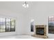 Bright open concept living room with large windows and stone fireplace at 7227 Otter Creek Dr, New Port Richey, FL 34655