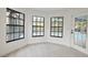 The sunroom overlooks the pool and has floor to ceiling windows for maximum light at 7227 Otter Creek Dr, New Port Richey, FL 34655