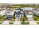Beautiful two-story home with a manicured lawn, attached garage, close to a pond and neighboring houses at 7334 Ashcroft Dr, Wesley Chapel, FL 33545