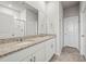 Spacious bathroom features a double vanity, granite countertops, and a large mirror at 7334 Ashcroft Dr, Wesley Chapel, FL 33545