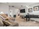 Cozy bonus room featuring comfortable seating and a piano, creating a perfect space for relaxation or entertainment at 7334 Ashcroft Dr, Wesley Chapel, FL 33545