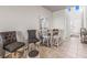 Cozy dining area features a modern table set near the entryway with plenty of natural light at 7334 Ashcroft Dr, Wesley Chapel, FL 33545