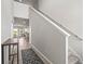 Inviting entryway with neutral paint and tile floors leading to the stairs and living area at 7334 Ashcroft Dr, Wesley Chapel, FL 33545