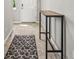 Inviting entryway featuring a console table and patterned rug at 7334 Ashcroft Dr, Wesley Chapel, FL 33545