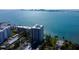 Fantastic aerial view of a waterfront condo building and surrounding tranquil bay at 80 Rogers St # 2A, Clearwater, FL 33756