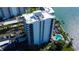 Detailed aerial view of modern high-rise with views of bay and tropical landscaping at 80 Rogers St # 2A, Clearwater, FL 33756