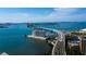 Aerial view showcasing the city skyline, bridge access, and waterfront location of the condo community at 80 Rogers St # 2A, Clearwater, FL 33756