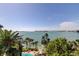 Amazing aerial view features palm trees, a pool, and serene bay views at 80 Rogers St # 2A, Clearwater, FL 33756