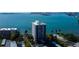 Gorgeous aerial view of condo and bay, showcasing lush landscaping and nearby amenities at 80 Rogers St # 2A, Clearwater, FL 33756