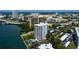 Beautiful aerial shot of condo building, showing the sparkling pool and waterfront access at 80 Rogers St # 2A, Clearwater, FL 33756