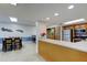 Shared kitchen and dining area with stainless steel appliances and seating for eight at 80 Rogers St # 2A, Clearwater, FL 33756