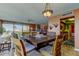 Comfortable dining room leading into kitchen featuring dark wood furniture and an airy, open space at 80 Rogers St # 2A, Clearwater, FL 33756