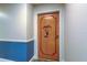 Condo entrance door with a wooden design and a decorative wreath at 80 Rogers St # 2A, Clearwater, FL 33756