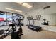 Well-lit gym with various cardio and weight training equipment, and a mirrored wall at 80 Rogers St # 2A, Clearwater, FL 33756