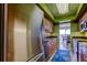 Bright kitchen with wood cabinetry, stainless steel appliances, and decorative rug at 80 Rogers St # 2A, Clearwater, FL 33756