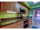 Charming kitchen with stainless steel appliances, wood cabinets, and decorative hardware at 80 Rogers St # 2A, Clearwater, FL 33756