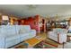 Spacious living room with ample seating and a glimpse of the dining area at 80 Rogers St # 2A, Clearwater, FL 33756
