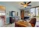 Comfortable living room with TV, waterfront views, and a tiled floor at 80 Rogers St # 2A, Clearwater, FL 33756