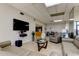 Comfortable living room with plush seating, a large TV, and stylish decor at 80 Rogers St # 2A, Clearwater, FL 33756