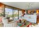 Cozy living area with a ceiling fan, large windows, and stunning waterfront views at 80 Rogers St # 2A, Clearwater, FL 33756