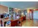 Well-lit office featuring a large collection of books and tiled floors at 80 Rogers St # 2A, Clearwater, FL 33756