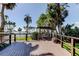 Spacious deck area with outdoor furniture, offering beautiful views of the pool and waterfront at 80 Rogers St # 2A, Clearwater, FL 33756