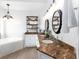 Bathroom featuring double sinks, decorative shelves, and a luxurious soaking tub at 9980 Sago Point Dr, Seminole, FL 33777